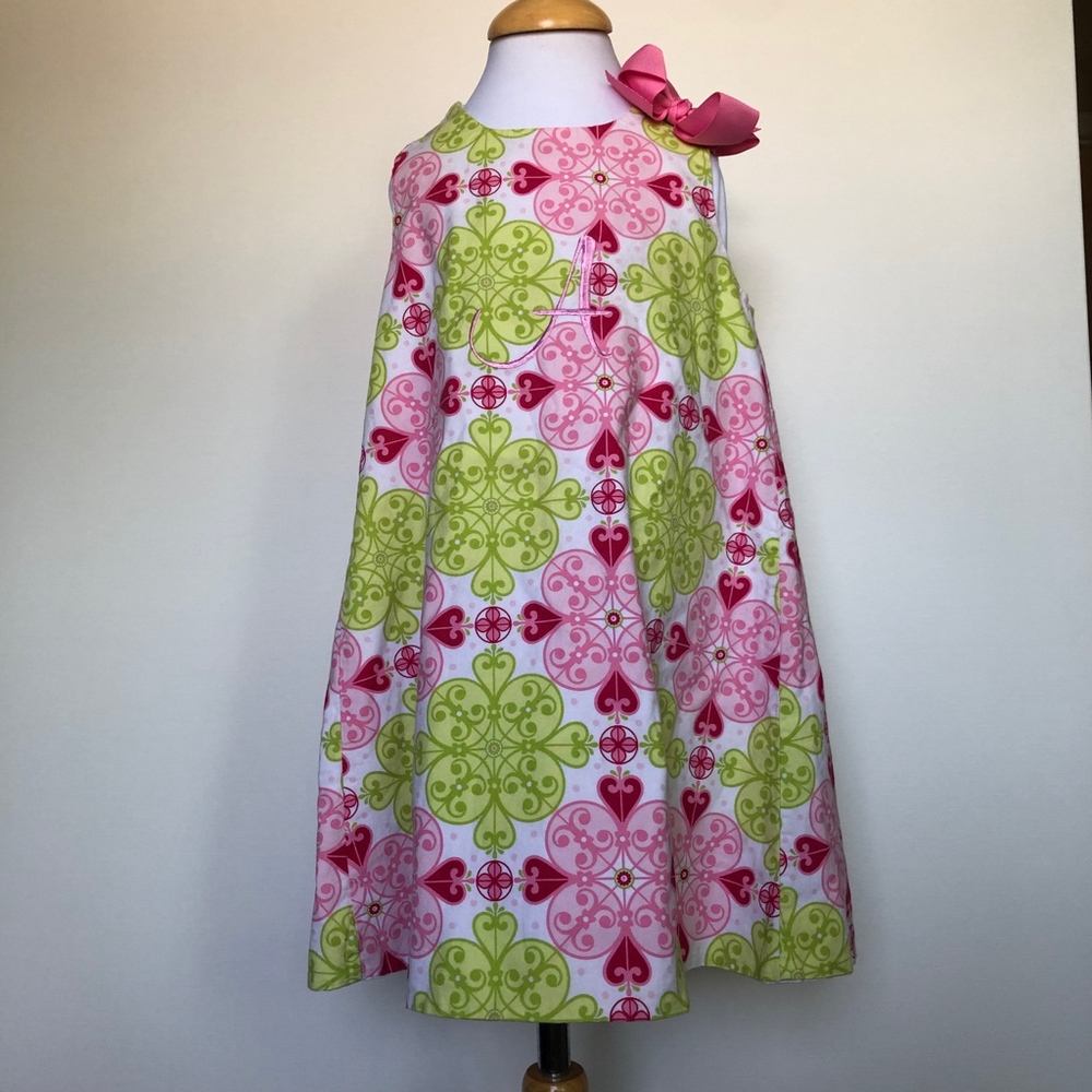Handmade dress with a A letter on it.